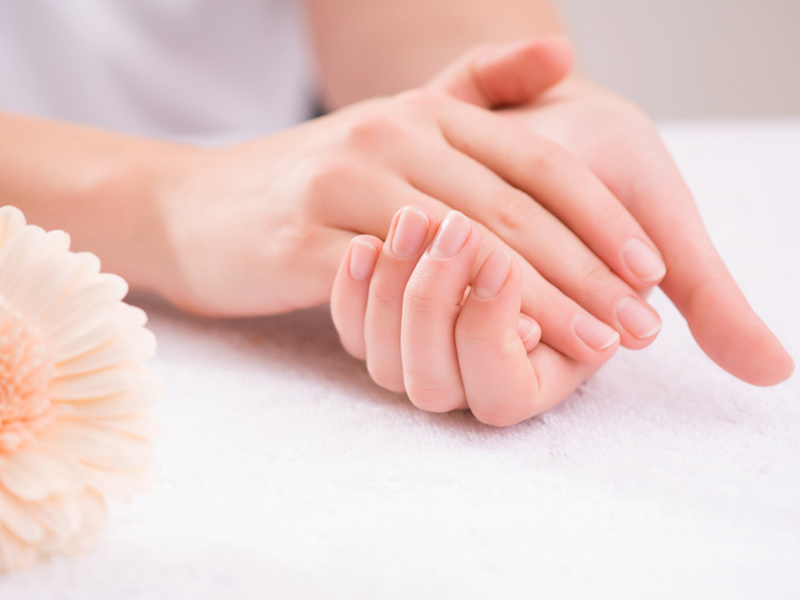 Pleasant woman making hand massage